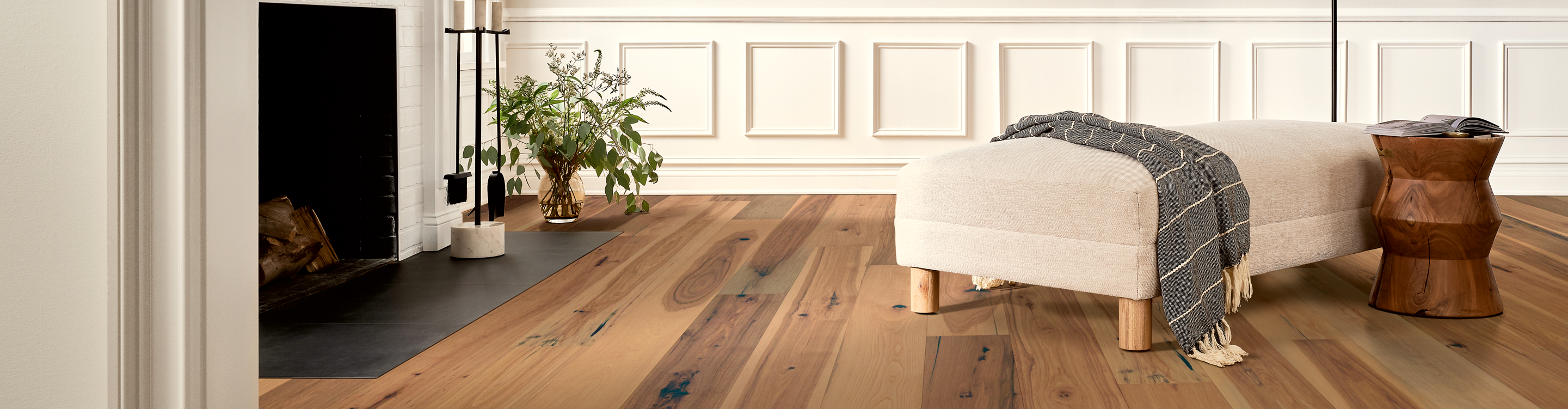 medium toned hardwood with natural knots in entryway and living room